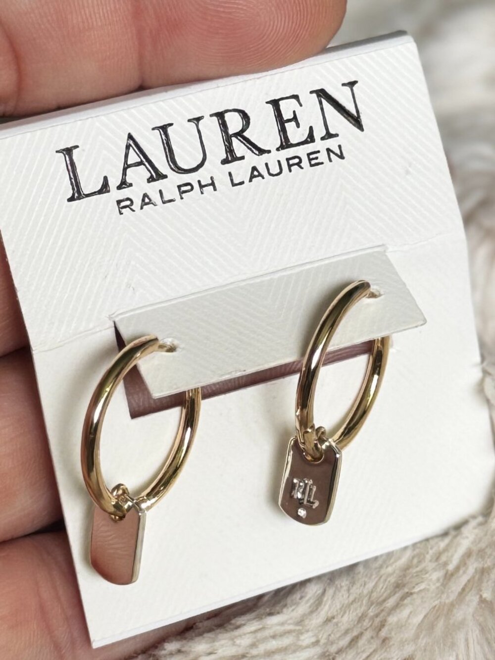 Ralph Lauren gold-tone drop hoop earrings with a small dangling tag detai